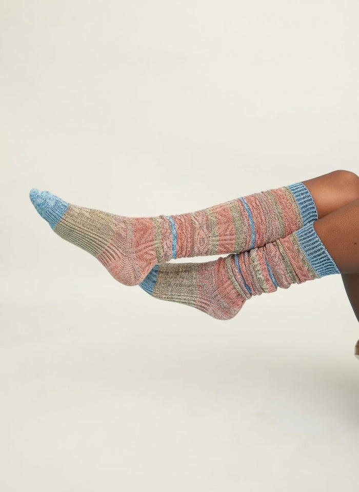 Colorful knitted socks on a light  background
