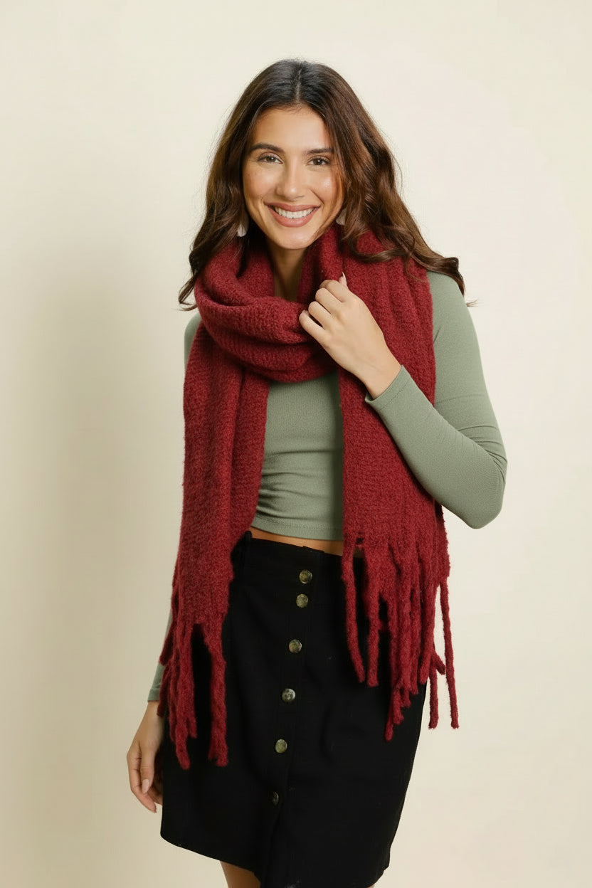 Woman wearing a red scarf in an outdoor setting